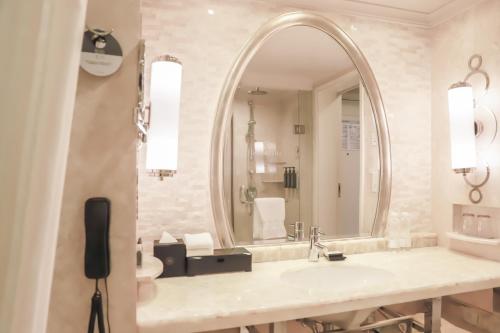 a bathroom with a sink and a mirror at Sheraton Xi'an Hotel in Xi'an
