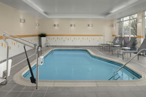 a large swimming pool in a hotel room at Fairfield by Marriott The Dalles in The Dalles