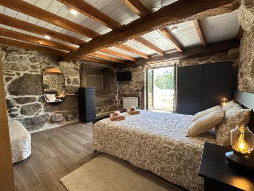 Ένα ή περισσότερα κρεβάτια σε δωμάτιο στο Casa Camu