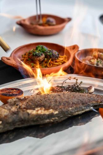 a table with a plate of food on a table at La Mouette et les Dromadaires in Essaouira