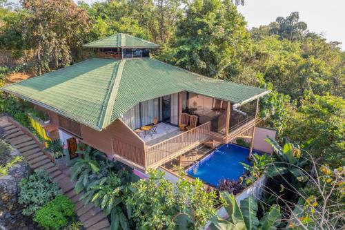 an overhead view of a house with a swimming pool at Simroseate in Agonda