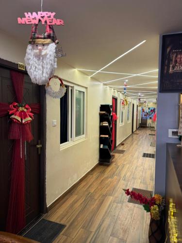 a hallway of a store with a christmas decoration at David Residency in Madurai