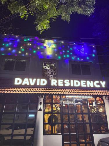 a building with a sign that reads dawn residency at David Residency in Madurai
