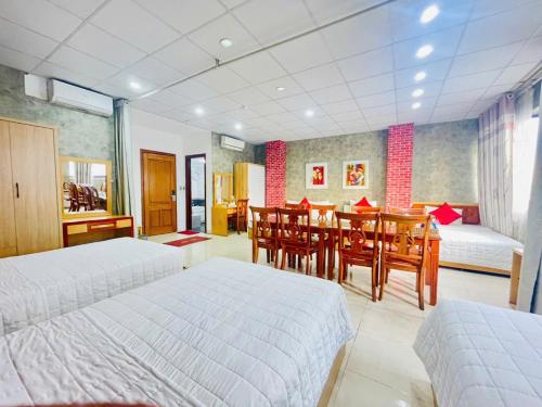 Postel nebo postele na pokoji v ubytování Moon Hotel Cau Giay
