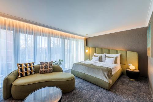 Postel nebo postele na pokoji v ubytování Riva Prestige Hotel