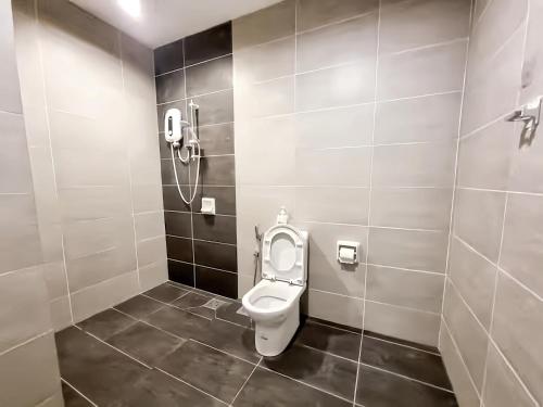 a bathroom with a toilet and a shower at Midhills Genting Highlands in Genting Highlands