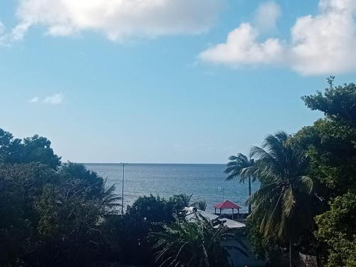 a view of the ocean from a resort at La villa du soleil 971 in Anse-Bertrand