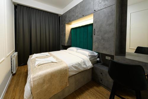 Postel nebo postele na pokoji v ubytování AXIOM Apartments