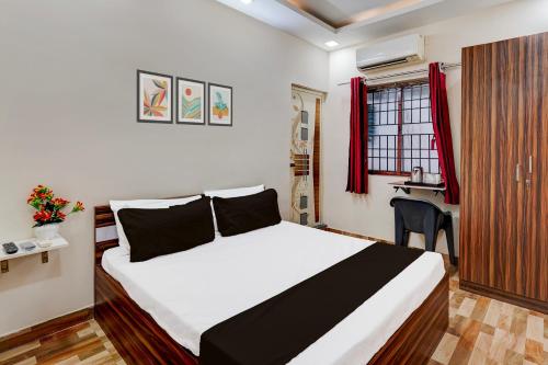 Postel nebo postele na pokoji v ubytování Super Hotel O Choolai Near Chennai Railway Station