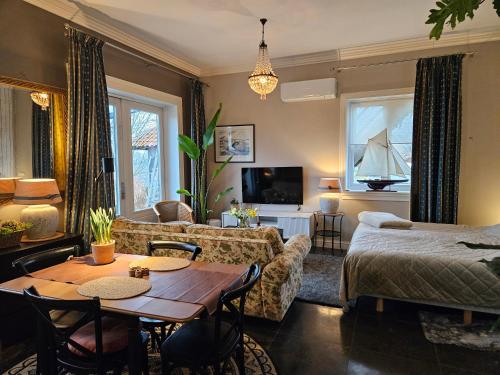 a living room with a couch and a table at Sea Breeze apartment Hellevoetsluis in Hellevoetsluis