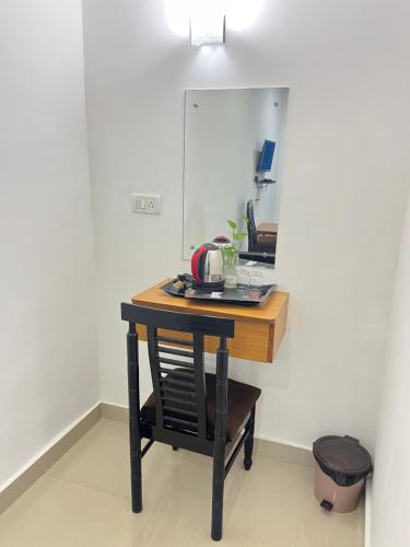 a table with a tea kettle on it in a room at Dom Pedros Haven Resort - Tranquil Retreat by the Sea in Utorda