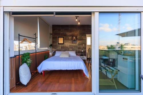 Katil atau katil-katil dalam bilik di AIOLOS Rooftop suite centre GLYFADA