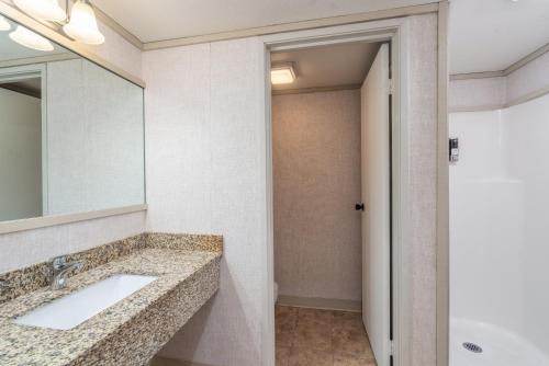 a bathroom with a sink and a mirror at Mountainside Inn 305 by Alpine Lodging Telluride in Telluride