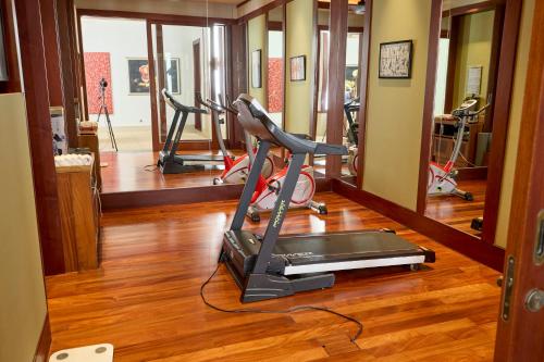 a gym with two treadmills and a treadmill at Villa 29 Montebello Andara Resort Villas in Kamala Beach