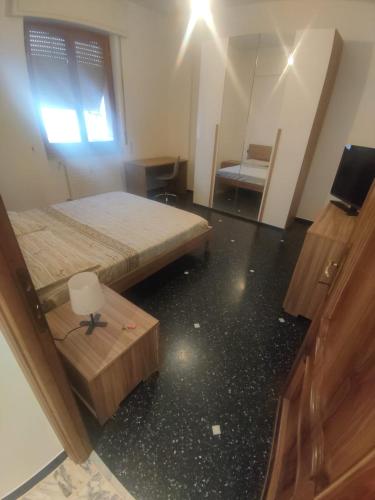 a room with two beds and a mirror at SWEET HOUSE dolce casa in Campomorone
