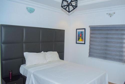 Postel nebo postele na pokoji v ubytování Cozy apartment en-suite