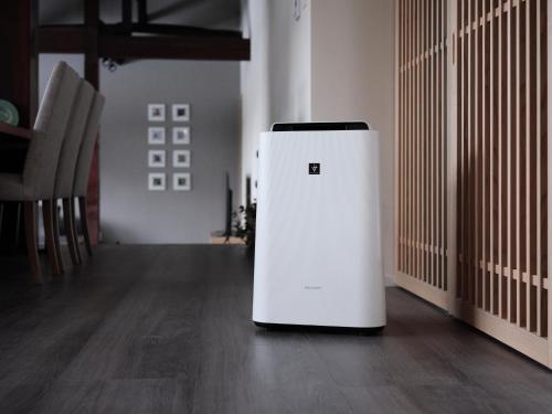 a small white refrigerator sitting in a room at 佐渡古民家ステイ さどまり 泉の家 in Sado