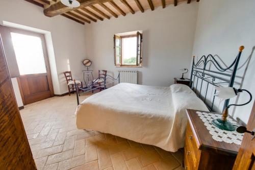 Ένα ή περισσότερα κρεβάτια σε δωμάτιο στο Agriturismo Bindozzino