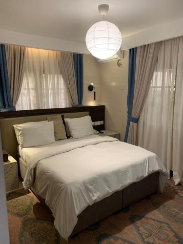 Postel nebo postele na pokoji v ubytování Centurion Aparthotel