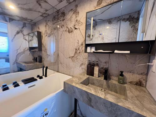 a bathroom with a sink and a mirror at Zao Sunvalley Hotel in Yamagata
