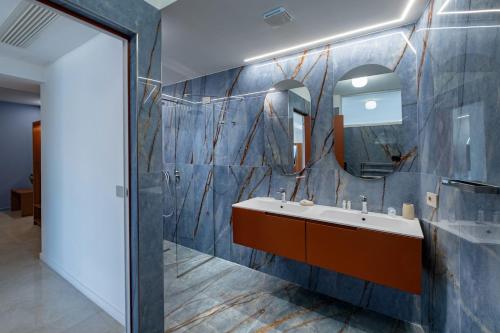 a bathroom with a sink and a mirror at Relais Manfredi in Castellammare di Stabia