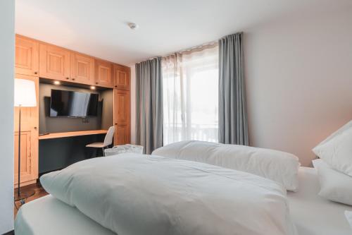 Ένα ή περισσότερα κρεβάτια σε δωμάτιο στο Hotel Kreuzberg Monte Croce