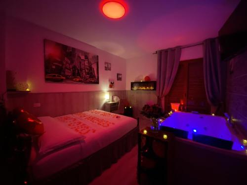 a bedroom with a bed and a hot tub in it at Perugia Suite in Perugia