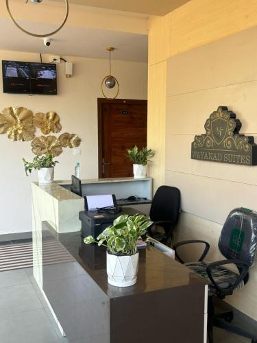 TV a/nebo společenská místnost v ubytování AJ Wayanad Suites