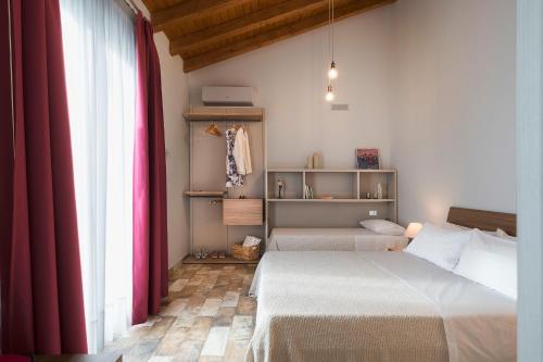 Ένα ή περισσότερα κρεβάτια σε δωμάτιο στο Siké