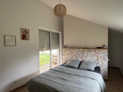 En eller flere senge i et værelse på MAISON CENTRE D'ARNAGE idéal 24h du Mans et Le Mans classic