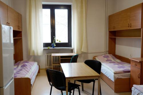 Postel nebo postele na pokoji v ubytování Dom Studencki Talizman