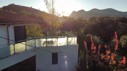 a balcony of a house with a view of the mountains at Villa Lucitello by Monarca, refuge Familial 5 personnes à 10 minutes de Saint Florent in Barbaggio
