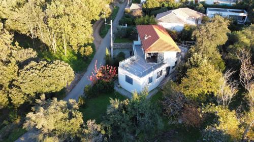 an overhead view of a white house with a yellow roof at Villa Lucitello by Monarca, refuge Familial 5 personnes à 10 minutes de Saint Florent in Barbaggio