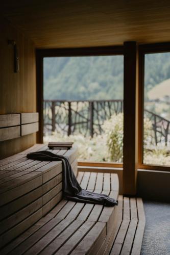 a room with a bed and a large window at SILENA, your soulful hotel - adults only in Valles