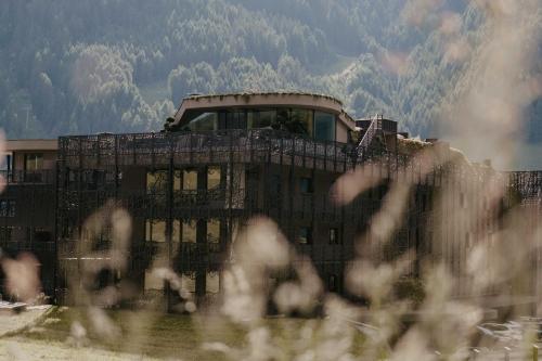 a building in front of a mountain at SILENA, your soulful hotel - adults only in Valles