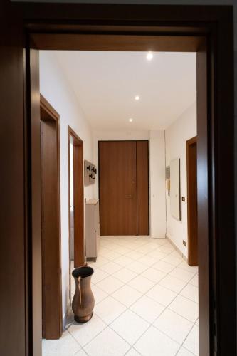 a room with a hallway with a door and a stool at Mar Beauty Apartment in Chioggia