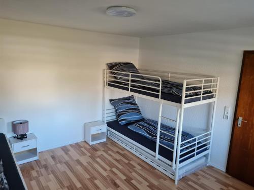 a couple of bunk beds in a room at Ferienwohnung Dreher in Aulendorf