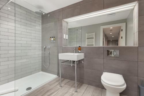 a bathroom with a toilet and a sink and a shower at Destiny Scotland - Distillers House in Edinburgh
