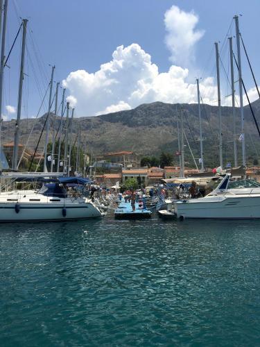 a group of boats docked in the water at Paleros Stone in Paleros