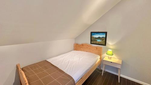 เตียงในห้องที่ Wildlife Retreat Central Lofoten
