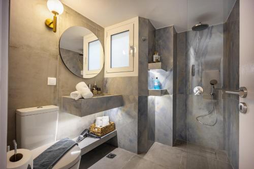 a bathroom with a shower and a toilet and a sink at Elegant Aphrodite, 2 Bedroom Apartment, by Acropolin in Athens