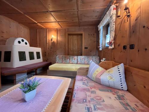 a living room with a couch and a table at Chalet Hannelore-3 by Interhome in Sölden