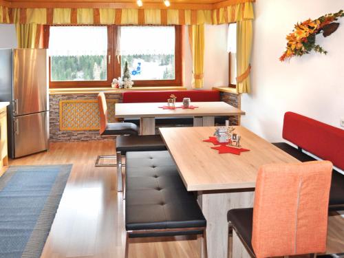 a kitchen and dining room with a table and chairs at Apartment Miramonte-3 by Interhome in Kappl