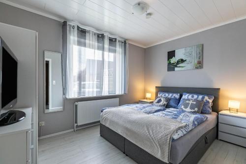 Ένα ή περισσότερα κρεβάτια σε δωμάτιο στο Terrassenwohnung Windsbraut