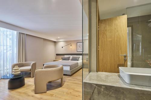 a hotel room with a bed and a sink at La Maja Hotel in Antalya