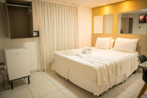 Cama ou camas em um quarto em Hotel Pousada Kairos Manaira