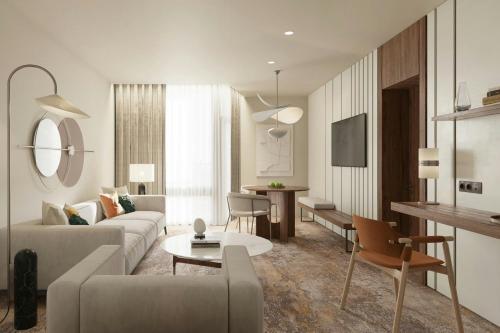 a living room with a couch and a table at Lisbon Marriott Hotel in Lisbon