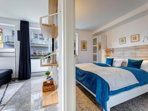 Кровать или кровати в номере Ostseeresidenz Gorki Park GP 07A mit Wellness und Schwimmbad