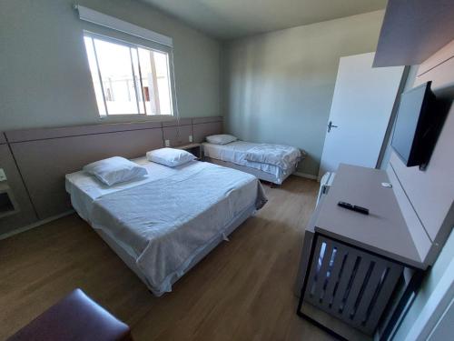 Postel nebo postele na pokoji v ubytování Hotel Pampas