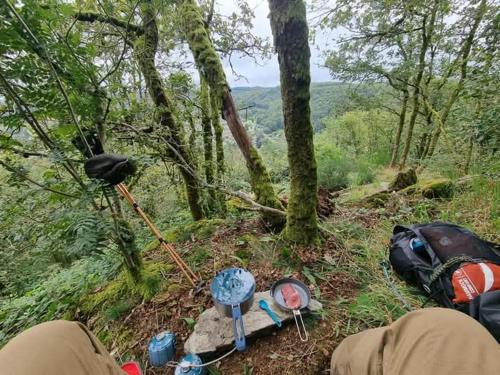 a group of items sitting on a trail in the woods at Au Vieux Lavoir in Alle